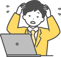 パソコンを前に悩む先生